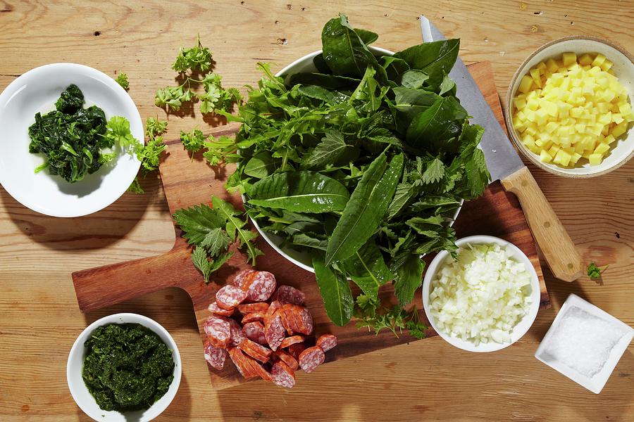 Ingredients For Heggenms stew Made With Wild Herbs, Green Kale And Sausages Photograph by Bjrn Llf