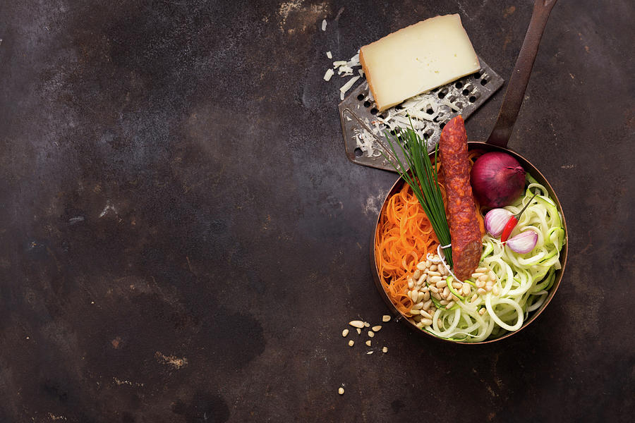 Ingredients For Hot Chorizo Zoodles With Chilli, Carrots, Manchego And Pine Nuts Photograph by Eising Studio