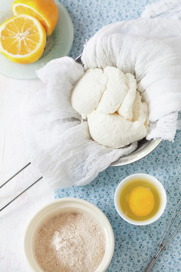 Ingredients For Leniwe Wareniki vanilla Ricotta Dumplings With Wholemeal Flour, Russia: Ricotta, Egg, Lemon And Flour Photograph by Yelena Strokin