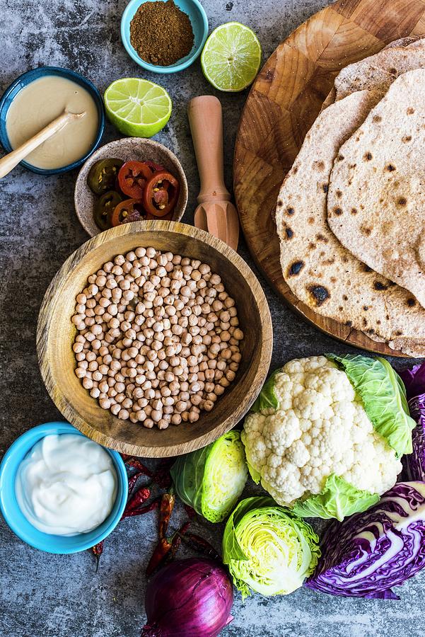 Ingredients For Pan-fried Cauliflower With Chickpeas And Spelt Flatbread Photograph by Hein Van Tonder