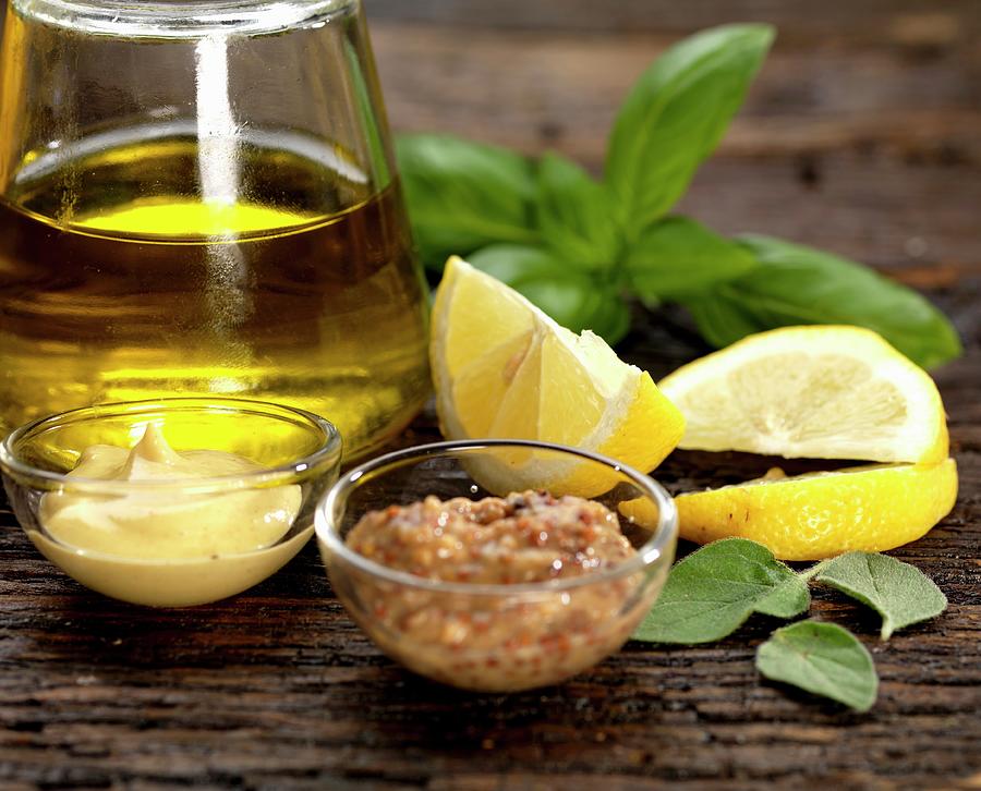 Ingredients For Salad Dressing With Olive Oil, Dijon Mustard, Hot Mustard, Lemon, Basil And Sage Photograph by Robert Morris
