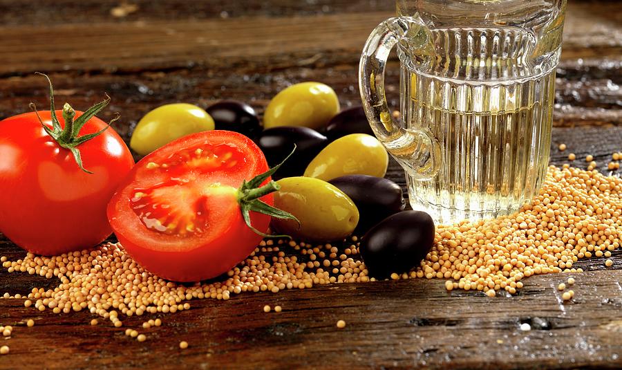 Ingredients For Salad Dressing With Sesame Seeds, Tomatoes, Olives And White Wine Vinegar Photograph by Robert Morris