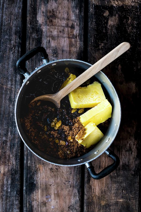 Ingredients For Spelt And Amaretto Fruit Cake In A Saucepan Photograph by Hein Van Tonder