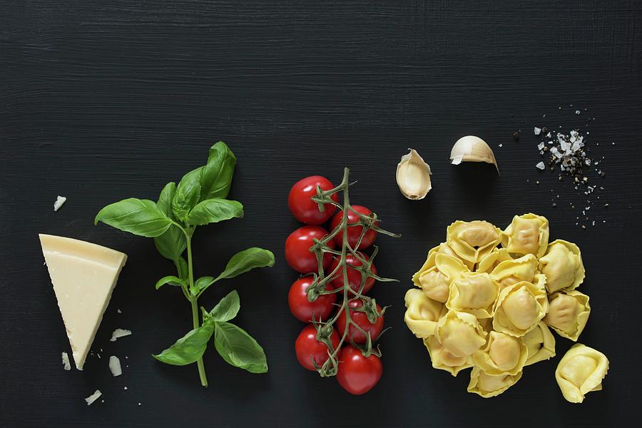 Ingredients For Tortellini With Tomato Sauce Photograph by Antti Jokinen
