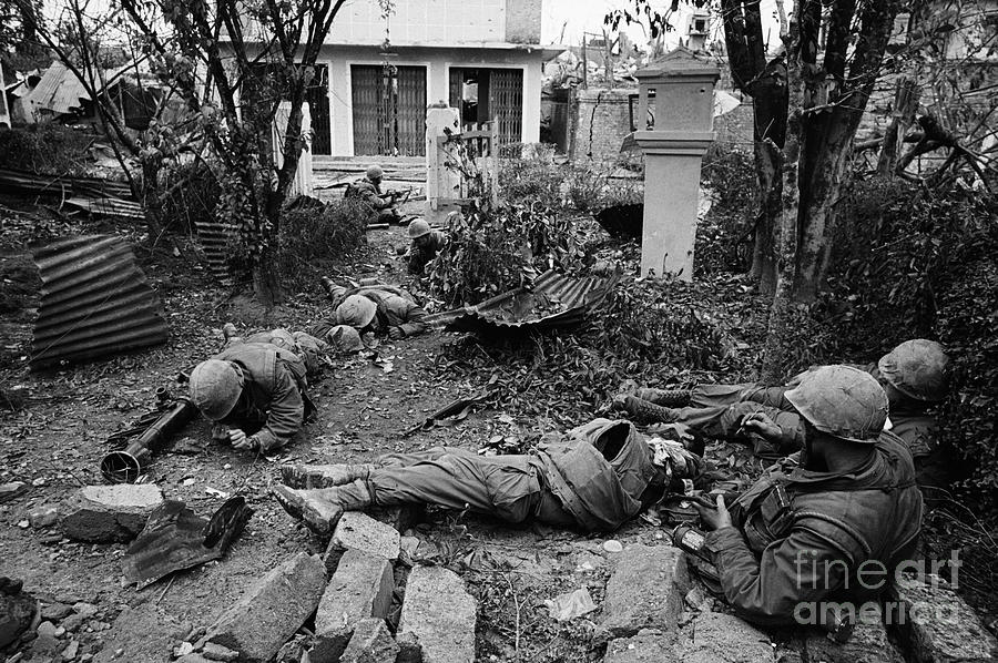 Injured Marines Lying On Ground Photograph by Bettmann