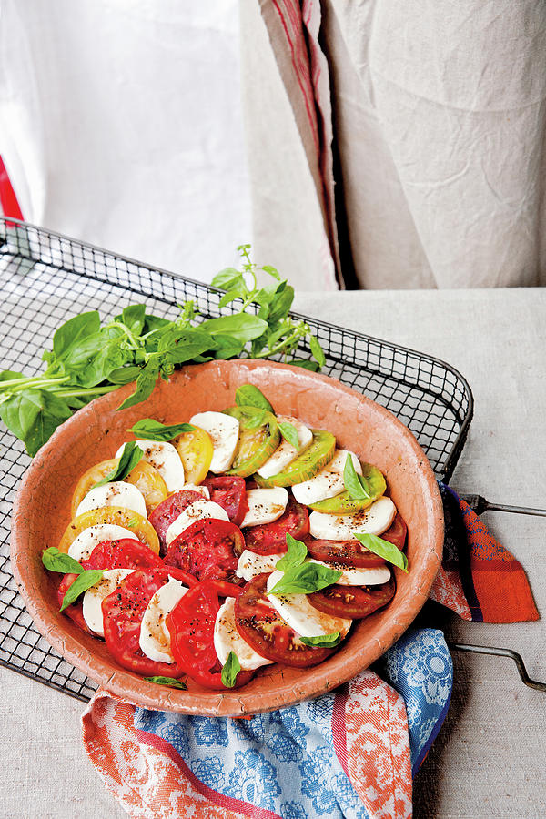 Insalata Caprese Made From Red And Yellow Tomatoes Photograph by Tre Torri