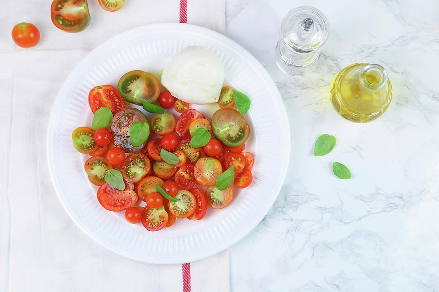 Insalata Caprese tomatoes With Mozzarella And Basil Photograph by Claudia Gargioni