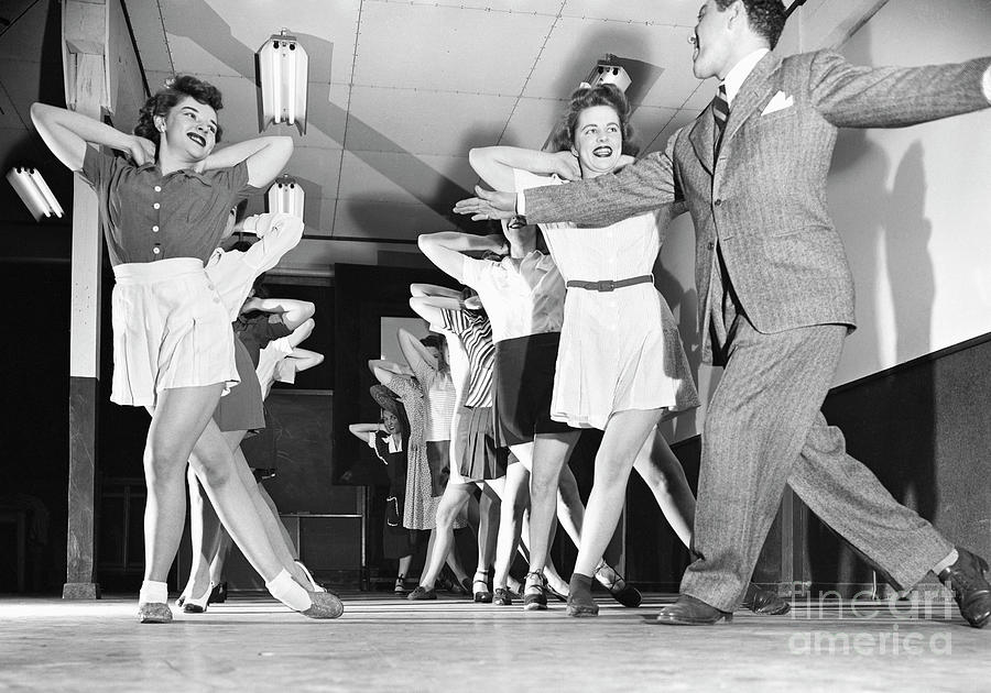 Instructor Leads Women Thru Danceexcerc Photograph by Bettmann