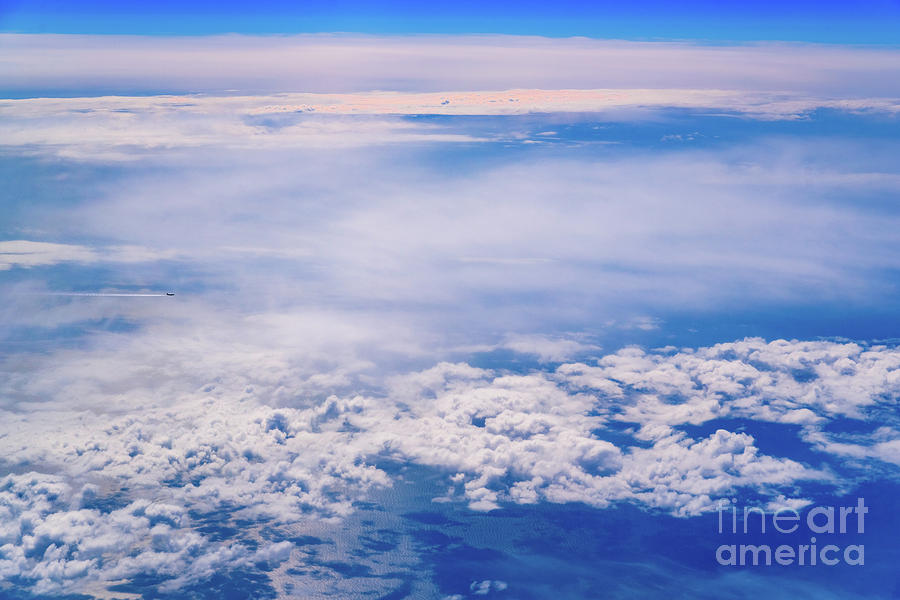 Intense Blue Sky With White Clouds And Plane Crossing It, Seen From Above In Another Plane. Photograph