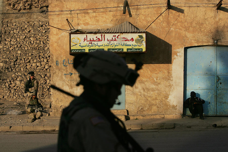 Iraqi Police Join U.s. Troops For Photograph by Chris Hondros
