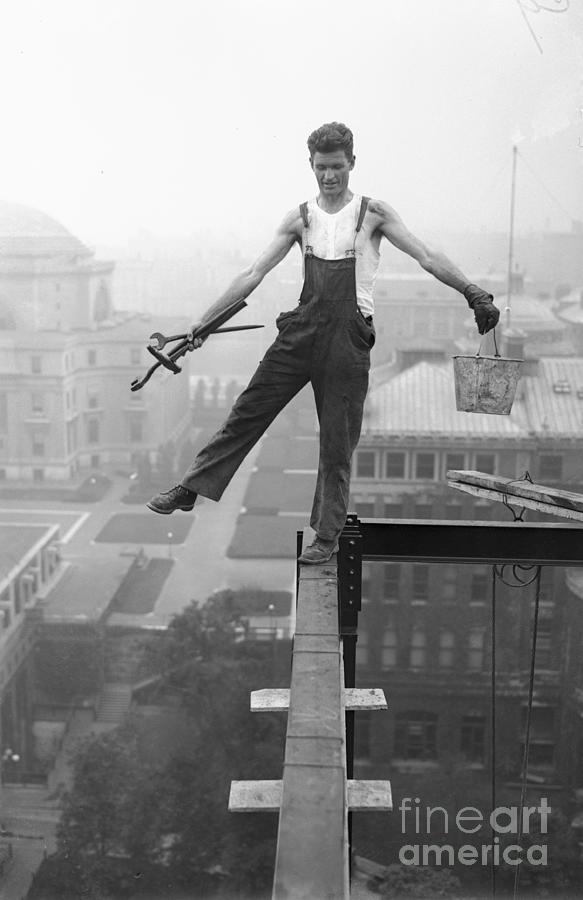 Iron Worker Balancing Across Beam Photograph by Bettmann