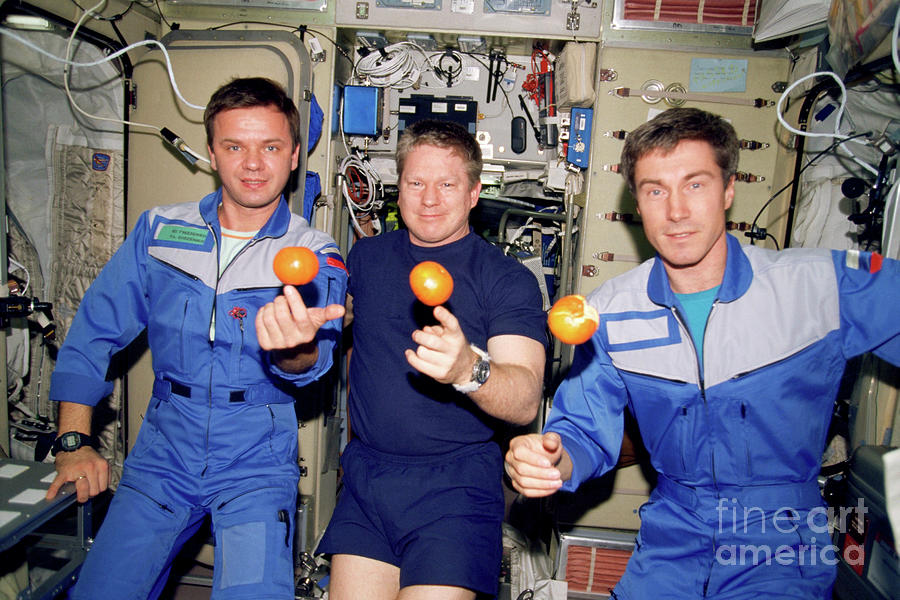 Iss Astronauts About To Eat Oranges Photograph by Nasa/science Photo Library