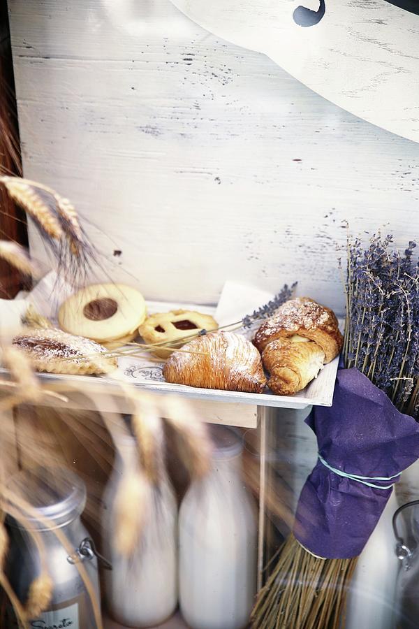 Italian Biscuits And Pastries Next To A Bunch Of Dried Lavender Photograph by Alexandra Panella