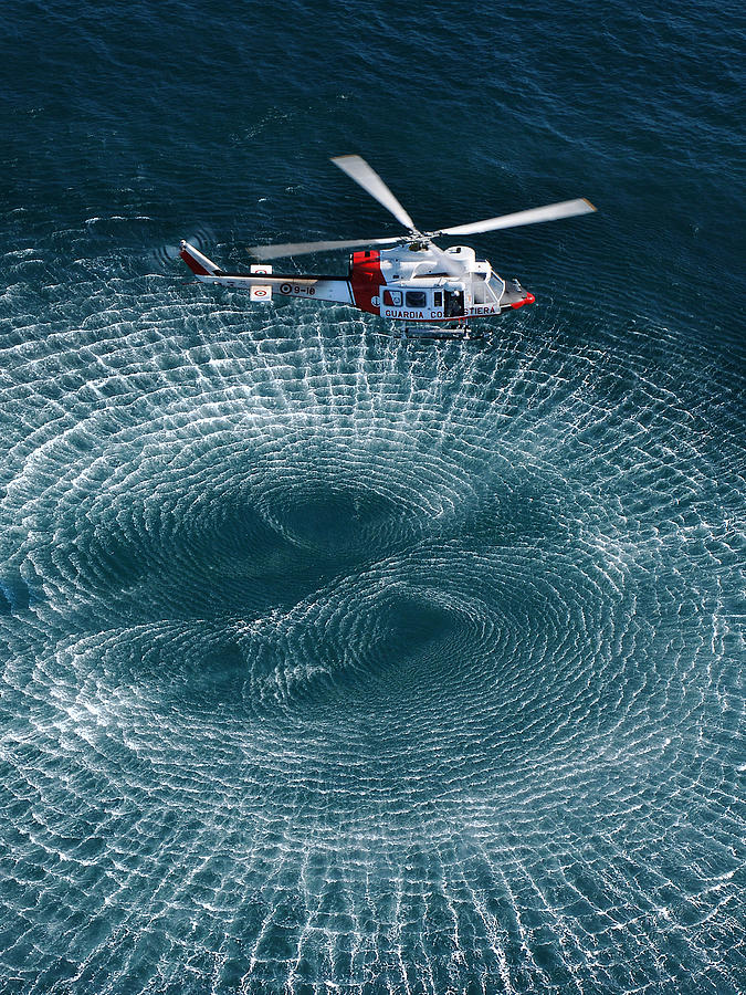 Helicopter Photograph - Italian Coast Guard: Hovering by Lorenzo Barsotti