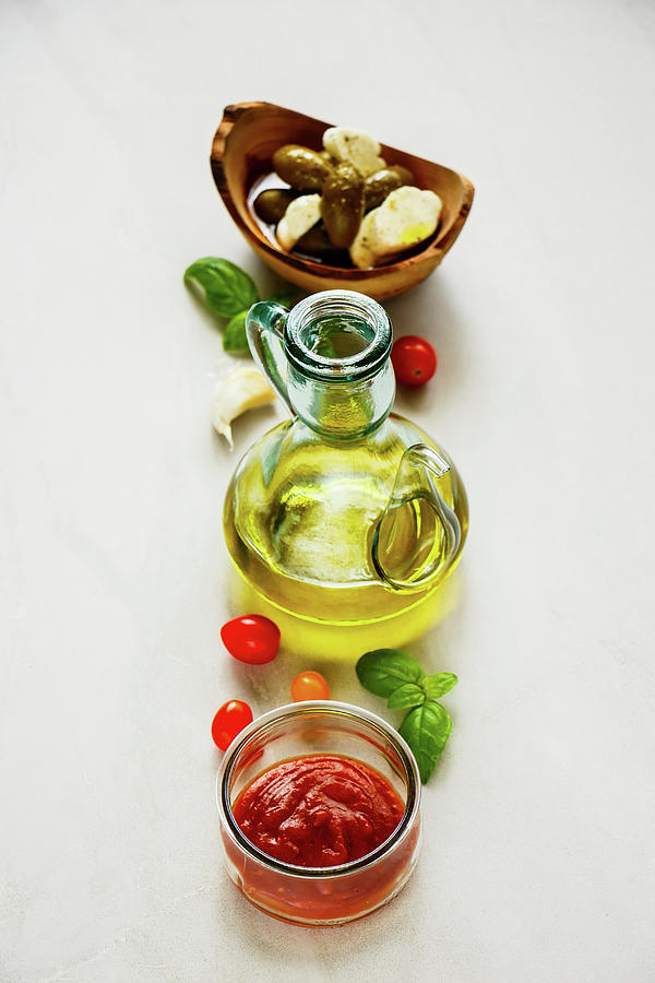 Italian Cooking Ingredients - Tomato Sauce, Olives, Mozzarella, Basil Leaves And Oil Photograph by Yuliya Gontar