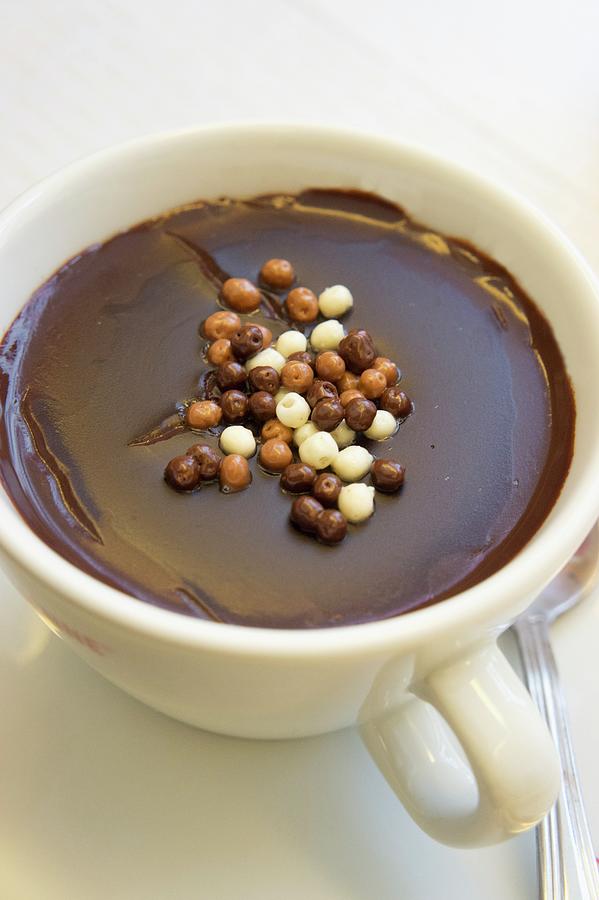 Italian Hot Chocolate Sprinkled With Crispy Chocolate Pearls Photograph by Martina Schindler