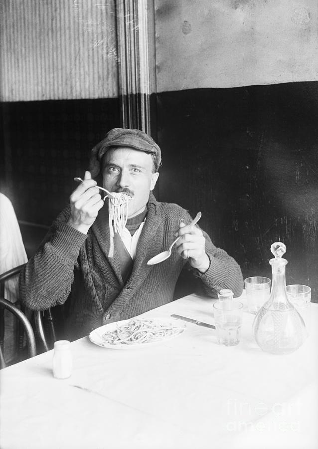 Italian Man Eating Spaghetti Photograph by Bettmann