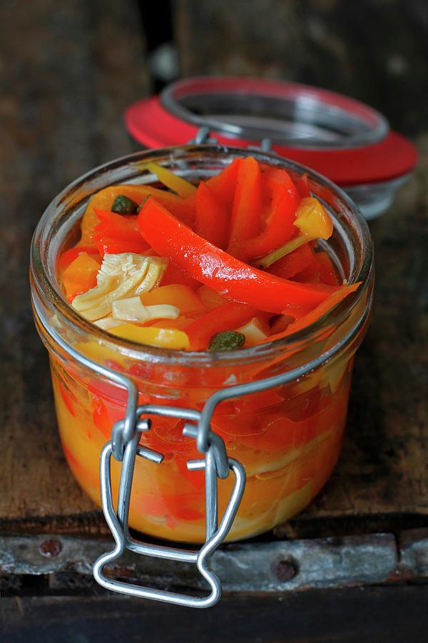 Italian Pickled Peppers In A Jar On A Rustic Wood Background Photograph by Ev Thomas
