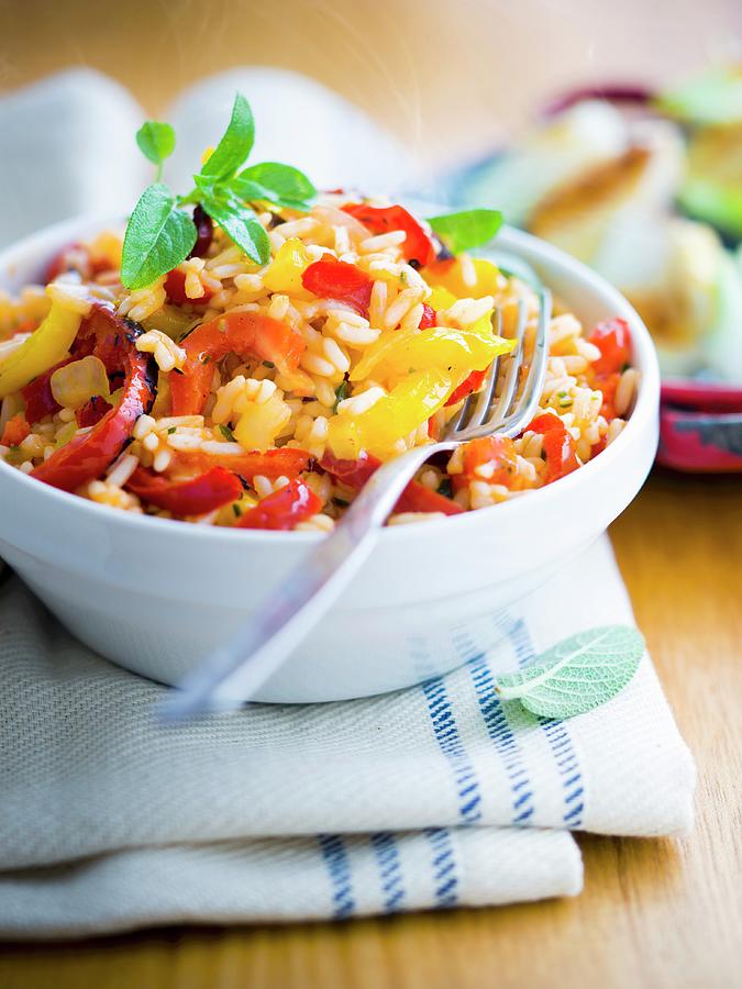 Italian-style Rice With Tomatoes, Peppers And Onions Photograph by Roulier-turiot