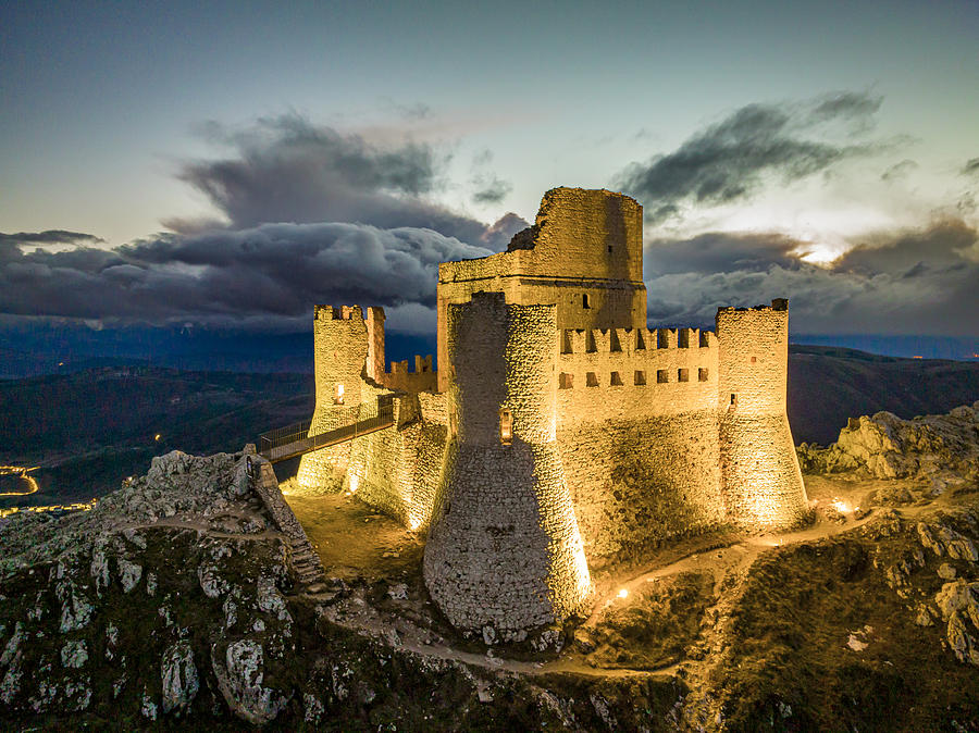 Italy, Abruzzo, Laquila District, Apennines, Gran Sasso National Park, Calascio, Rocca Calascio Castle During The Blue Hour After Sunset, In The Gran Sasso National Park Digital Art by Manfred Bortoli