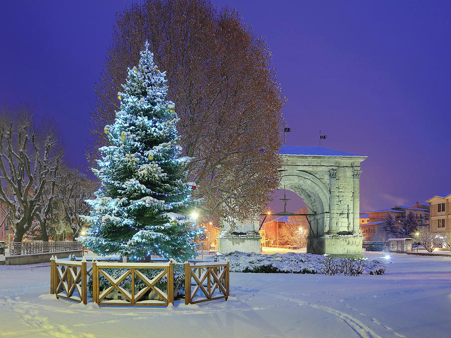 Italy, Aosta Valley, Aosta District, Alps, Aosta, Christmas Tree And The Arch Of Augustus After A Snowfall Digital Art by Davide Carlo Cenadelli