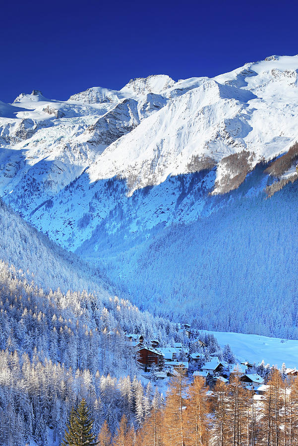 Italy, Aosta Valley, Aosta District, Alps, Val Di Cogne, Cogne, The Village Of Cogne And The Gran Paradiso Group In Background After A Winter Snowfall Digital Art by Davide Carlo Cenadelli