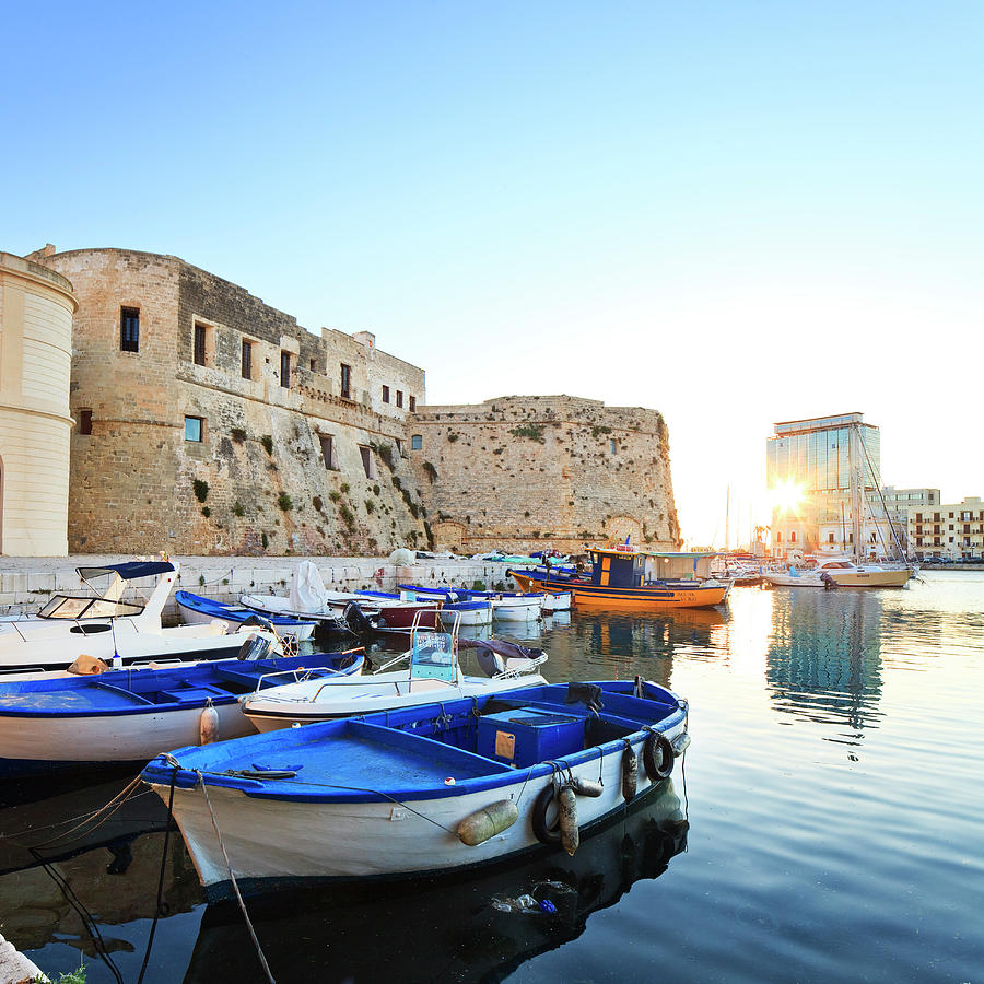 Italy, Apulia, Lecce District, Mediterranean Sea, Salento, Gallipoli, View Of The Walled Old City From The Harbor, With The Castle And Fishing Boats Digital Art by Luigi Vaccarella
