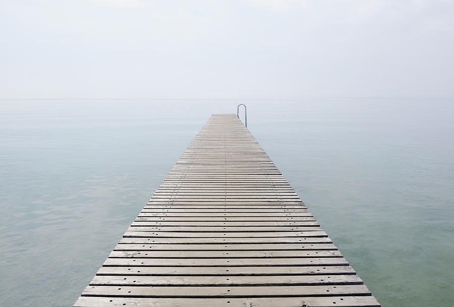 Italy, Jetty On Lake Garda In Mist Photograph by Westend61