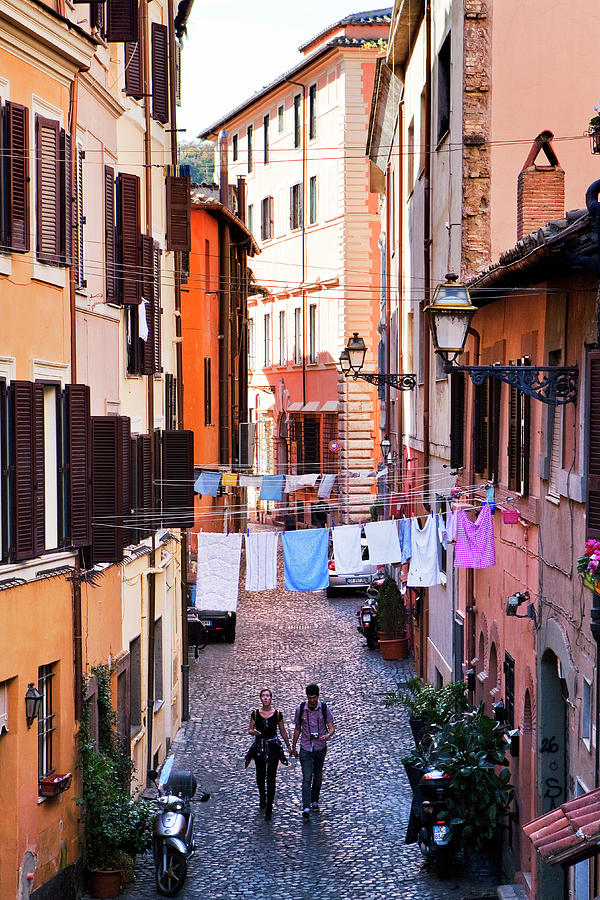 Italy, Latium, Roma District, Rome, Trastevere, Couple Walking In The Alleys Of Trastevere Digital Art by Luigi Vaccarella