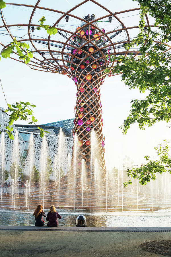 Italy, Lombardy, Milano District, Rho, Rho Fair, People Are Watching Water Games In The Lake Arena And The Tree Of Life At Milan Expo 2015, Italy.  Marco Balich. Contemporary Architecture. Digital Art by Matteo Rossi