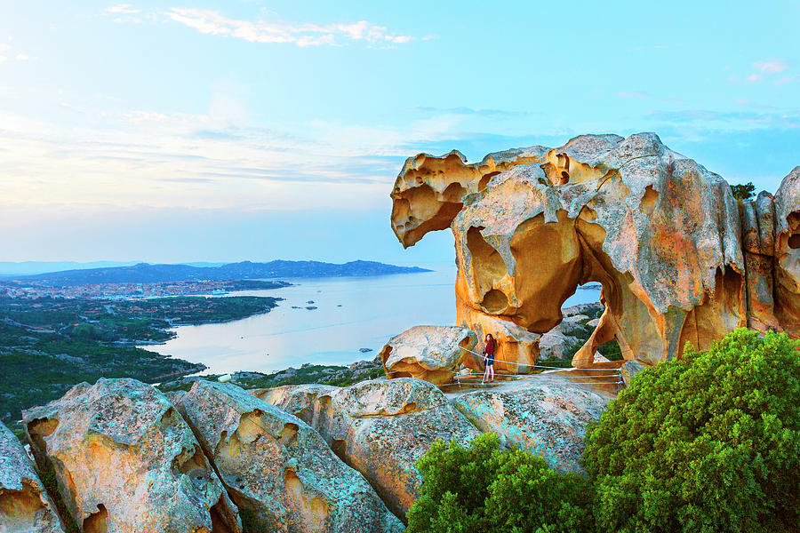 Italy, Sardinia, Olbia-tempio District, Mediterranean Sea, Palau, The Bear Rock (roccia Dellorso) At Dusk, The Most Famous Rock Formations At Capo Dorso And Palau Town In The Background Digital Art by Marco Arduino