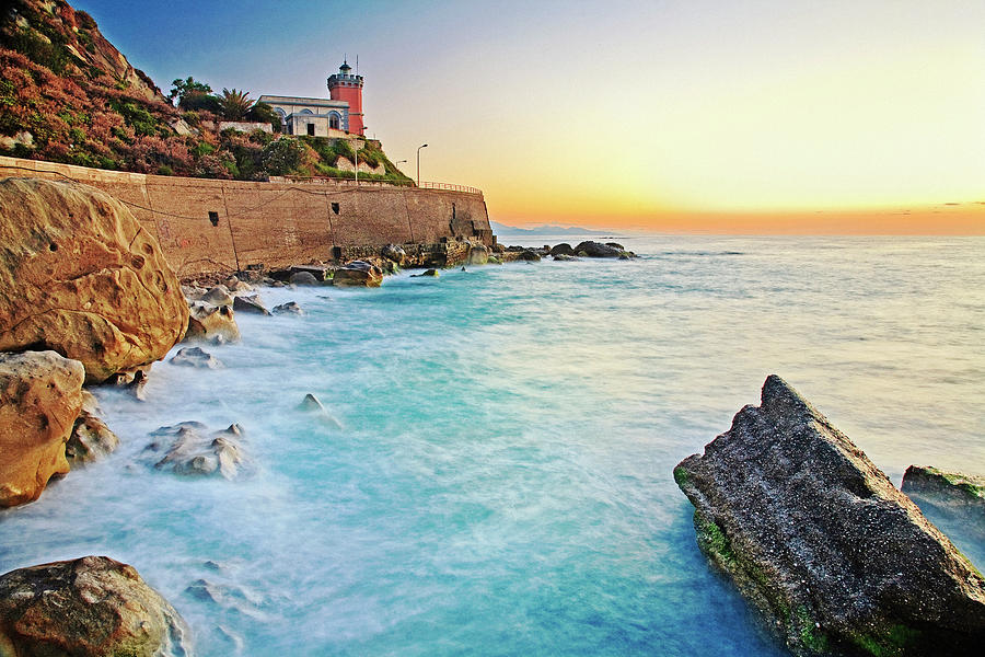 Italy, Sicily, Messina District, Capo Dorlando, Beach And Lighthouse In Background Digital Art by Antonino Bartuccio