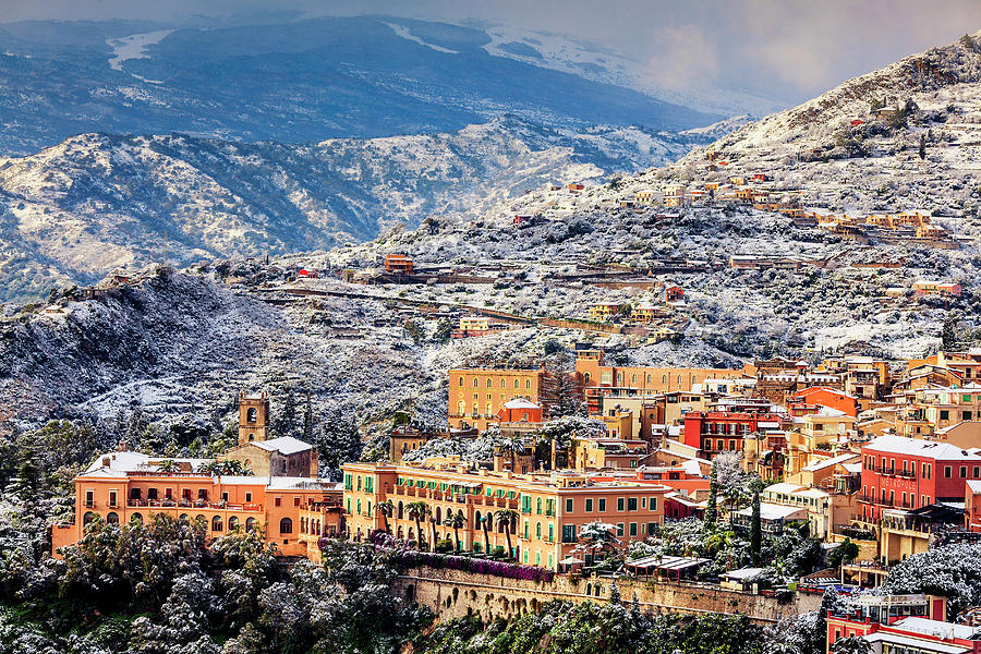 Italy, Sicily, Messina District, Taormina, Taormina In The Snow With Mount Etna In The Background Digital Art by Alessandro Saffo