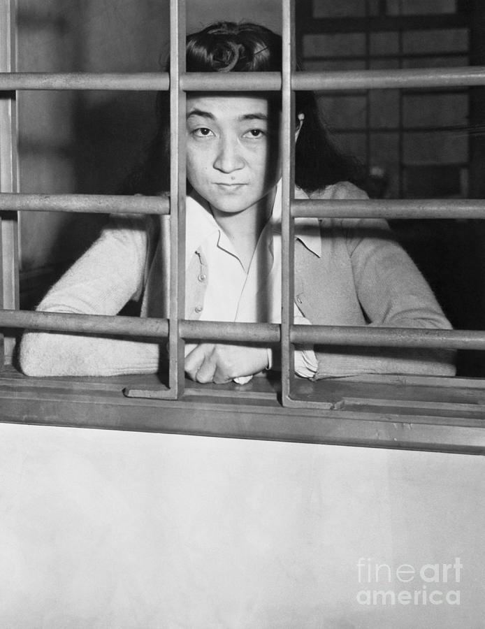 Iva Toguri Sitting Behind Bars In Jail Photograph by Bettmann