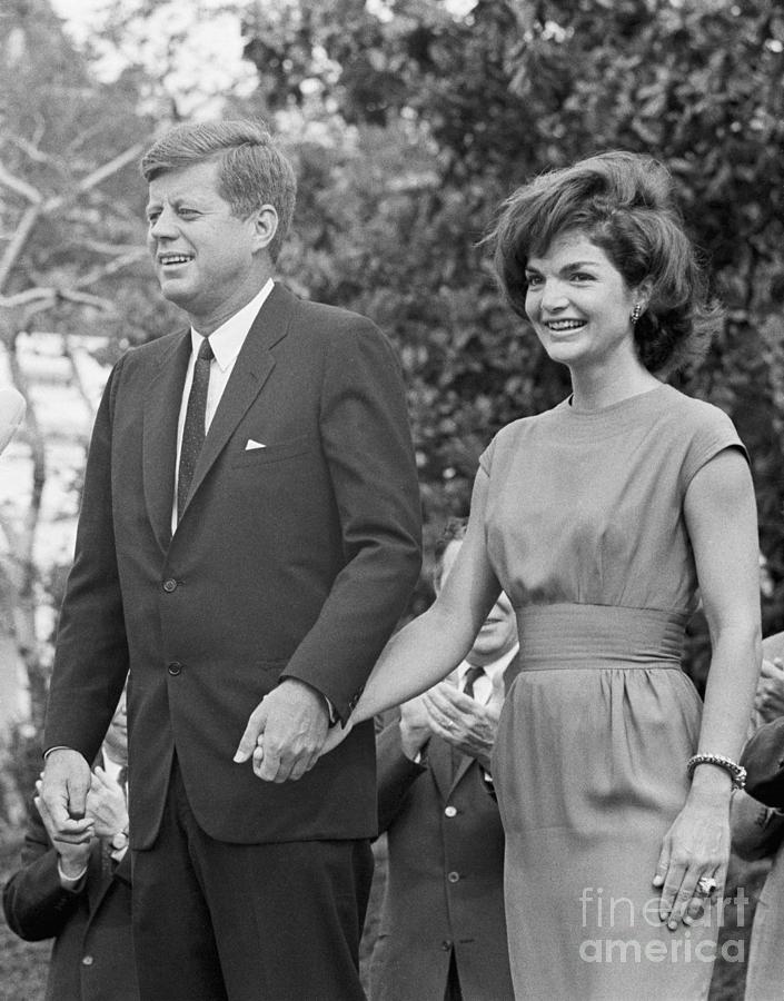 Jack And Jackie Kennedy Hold Hands Photograph by Bettmann