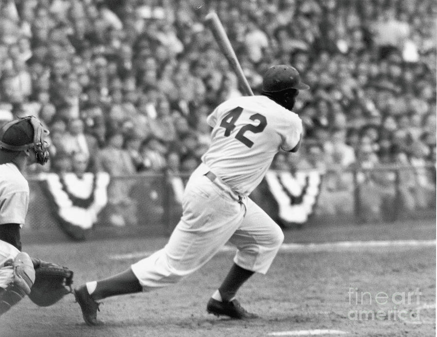 Jackie Robinson in Brooklyn Dodgers, swinging bat Poster by American Photo  - Fine Art America