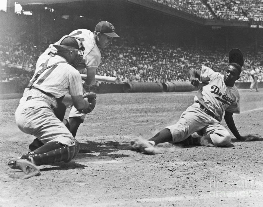 Jackie Robinson Steals And Slides by Bettmann