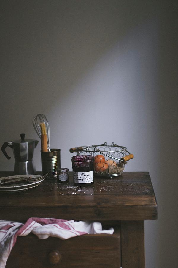 Jam, Baking Utensils, Plates And An Espresso Machine On A Wooden Chest Of Drawers Photograph by Tanya Balianytsia