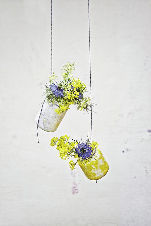 Jam Jars Covered In Tissue Paper Hung From Strings And Used As Vases Photograph by Patsy&christian
