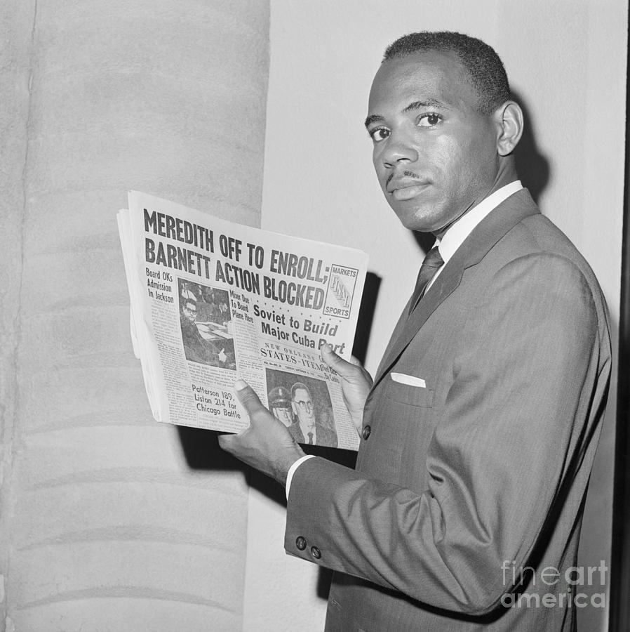 James Meredith Holding Newspaper Photograph by Bettmann