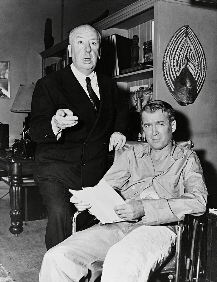 JAMES STEWART and ALFRED HITCHCOCK in REAR WINDOW -1954-. Photograph by Album
