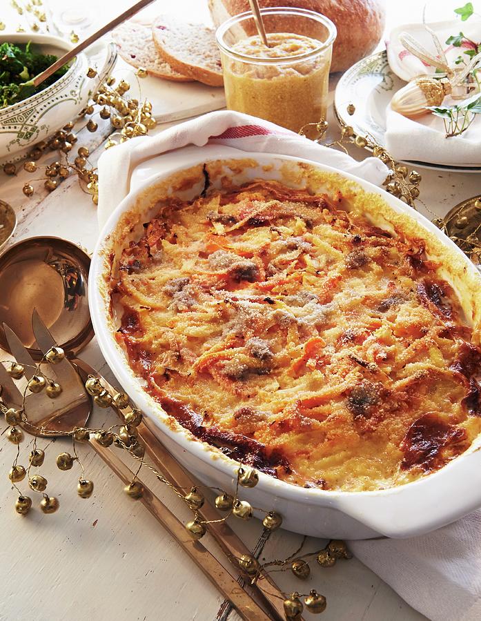 Janssons Frestelse potato Gratin From Sweden With Root Vegetables For Christmas Photograph by Hannah Kompanik