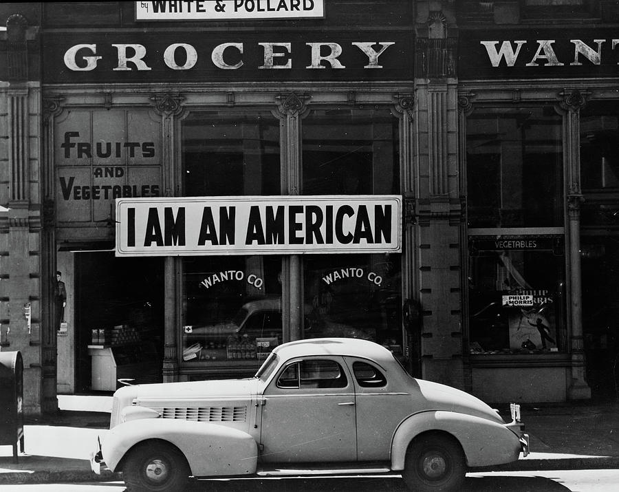 Japanese American Shop Owner In Oakland, California Hopes To Avoid Internment After The Bombing Of Pearl Harbor, 1942 Photograph by Dorothea Lange
