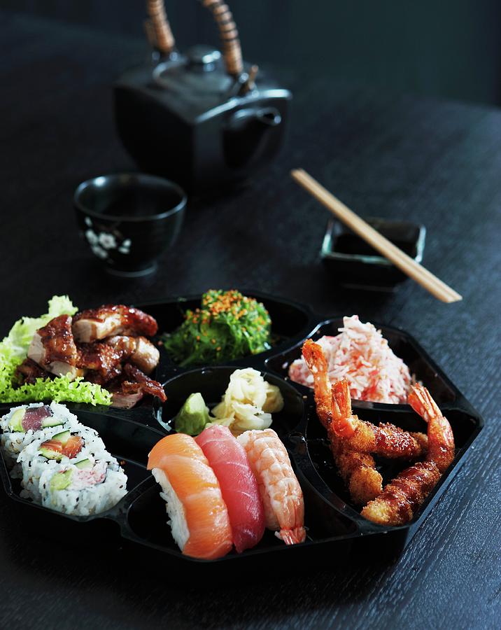 Japanese Food On A Black Plate Photograph by Mikkel Adsbl