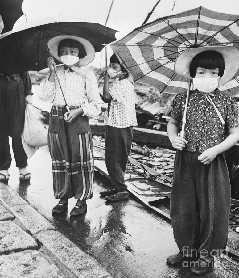 Japanese Girls Wearing Masks Photograph by Bettmann