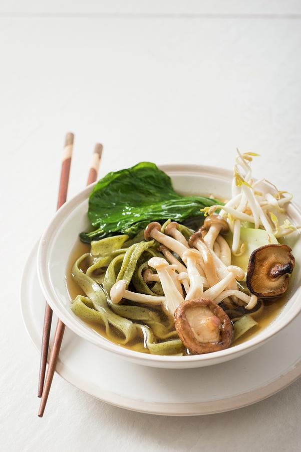 Japanese Noodle Soup With Mushrooms And Fresh Spinach Noodles Photograph by Great Stock!