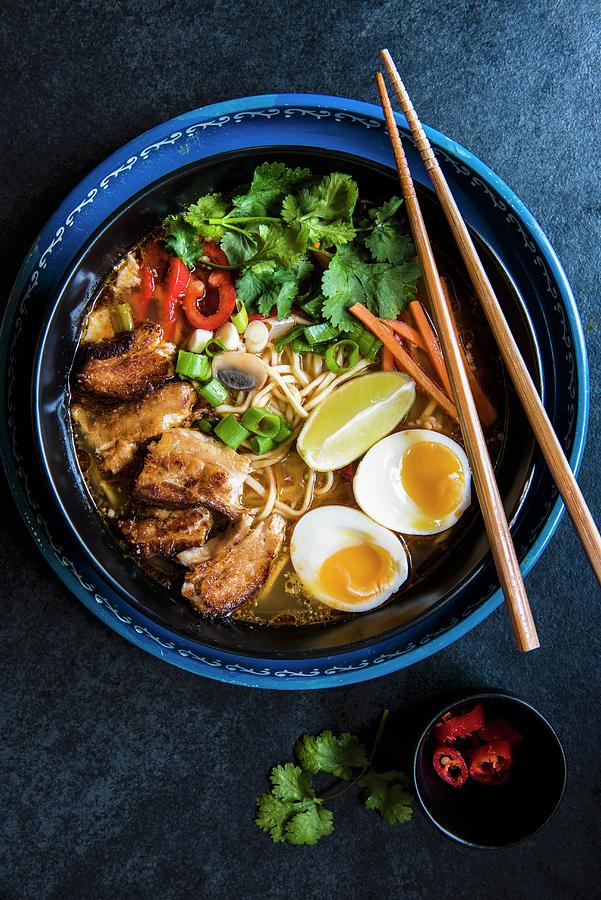 Japanese Ramen Noodle Soup With Slow Cooked Pork, Coriander And Egg Photograph by Magdalena Hendey