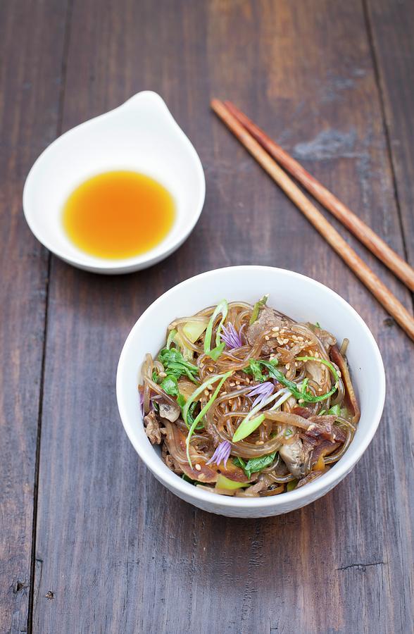 Japchae glass Noodle Dish From Korea With Shiitake Mushrooms And Spinach Photograph by Rika Manabe Photography