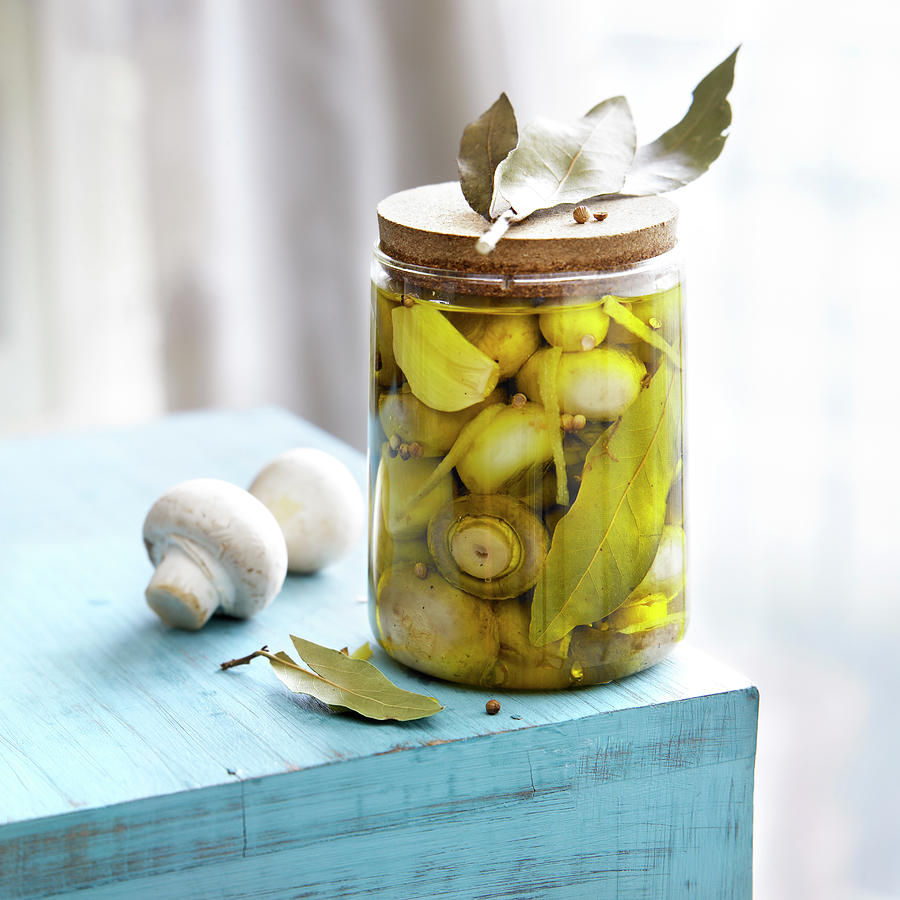 Jar Of Mushrooms In Oil Photograph by Radvaner