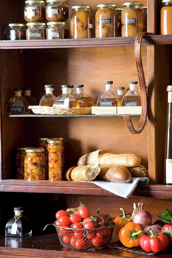 Jars, Bread And Fresh Vegetables In A Pantry Photograph by Danny Lerner